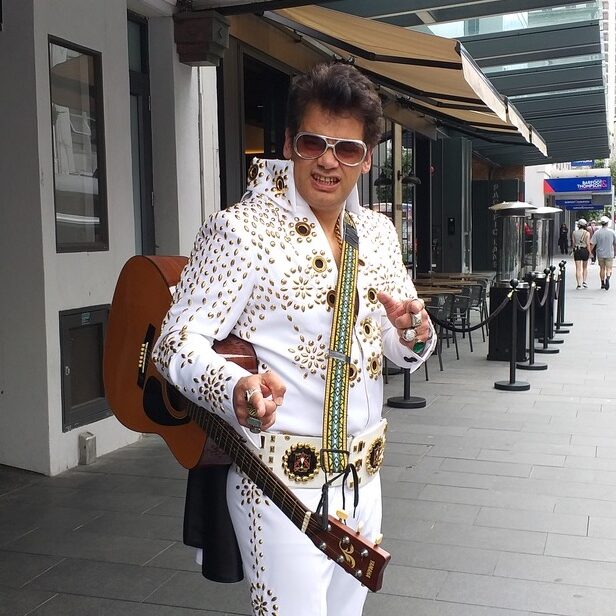 A photo of Jarred Tito, singer-entertainer on a street in Auckland CBD